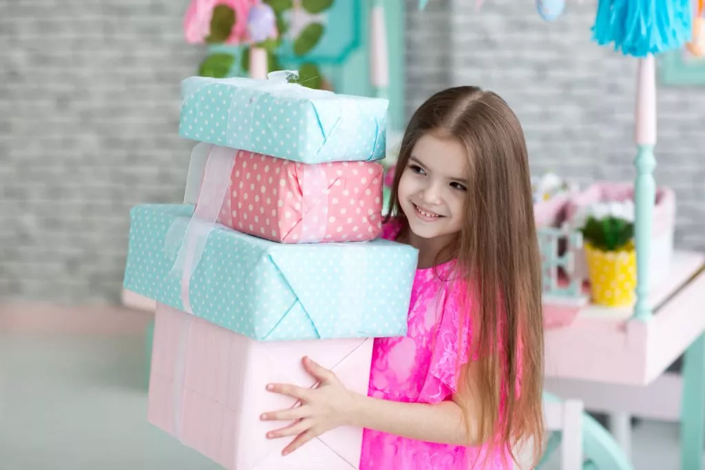 pretty-little-girl-in-dress-with-presents.jpg